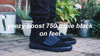 black yeezy 750 on feet
