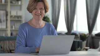 Smiling Old Senior Woman Looking at Camera while Working on Laptop | Stock Footage - Videohive