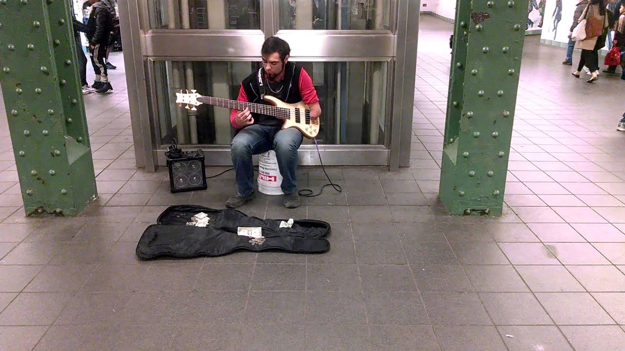 1 Armed Guitar Player in the Subway Station
