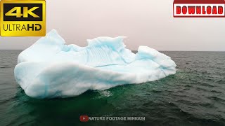 🎁4K Travelling shot of blue iceberg floating in ocean | DAILY NATURE FOOTAGE