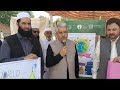 Muhammad Arif E/D Saiban Development Organization Vaccinating Child on World Polio Day