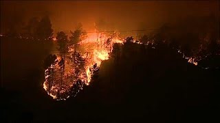 'Over 30 dead' as wildfires rage in Portugal and Spain