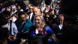 Le Pen in final push for support as Russia questions linger