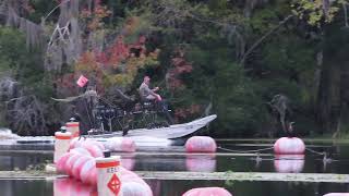 Florida man's airboat going over a dam on the Withlacoochee River