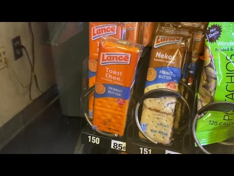 Grabbing a snack from the vending machine at work.