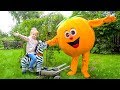 Giant fruit toys and funny kid playing in the garden Video for children