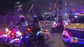 Police motorcycle units escort body of fallen Temple University officer