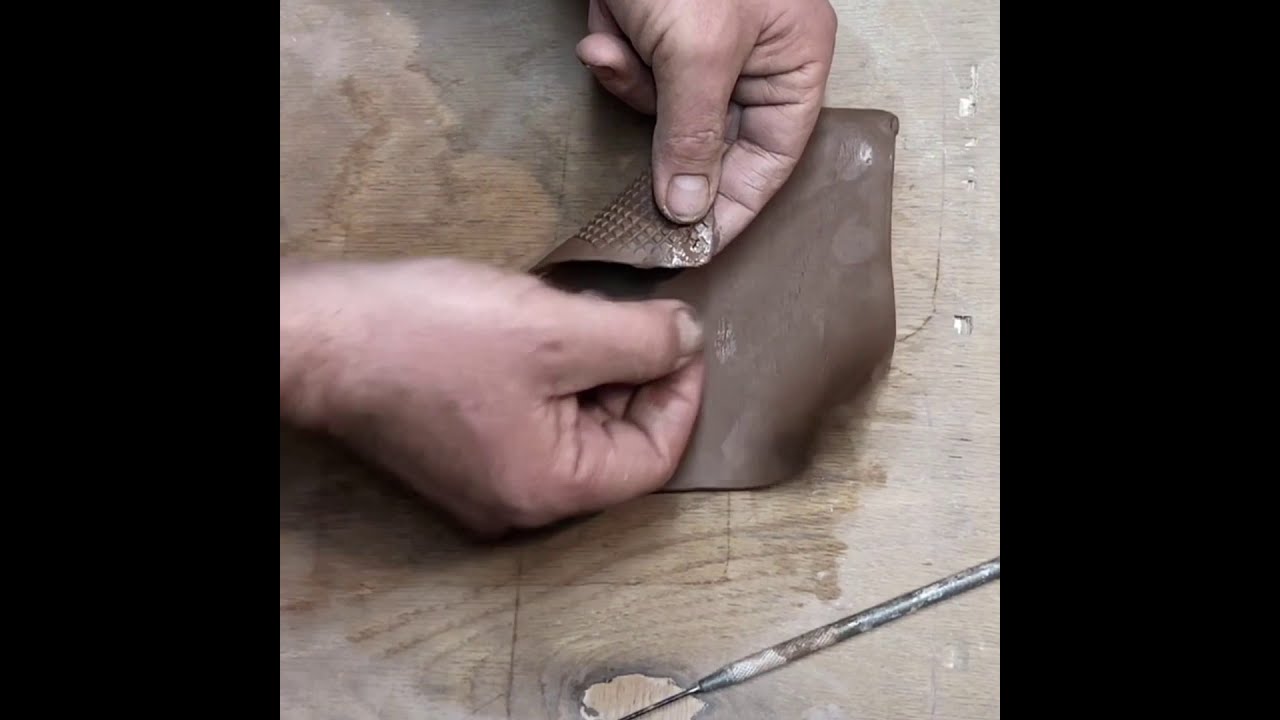Video thumbnail of a slab-built ceramic wall pocket