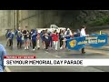 Umbrellas in hand, Seymour holds Memorial Day parade