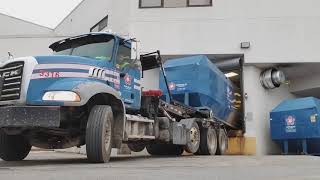 Rolloff compactor on dock