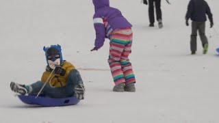 Kids enjoy sledding in Dallas at Flag Pole Hill park