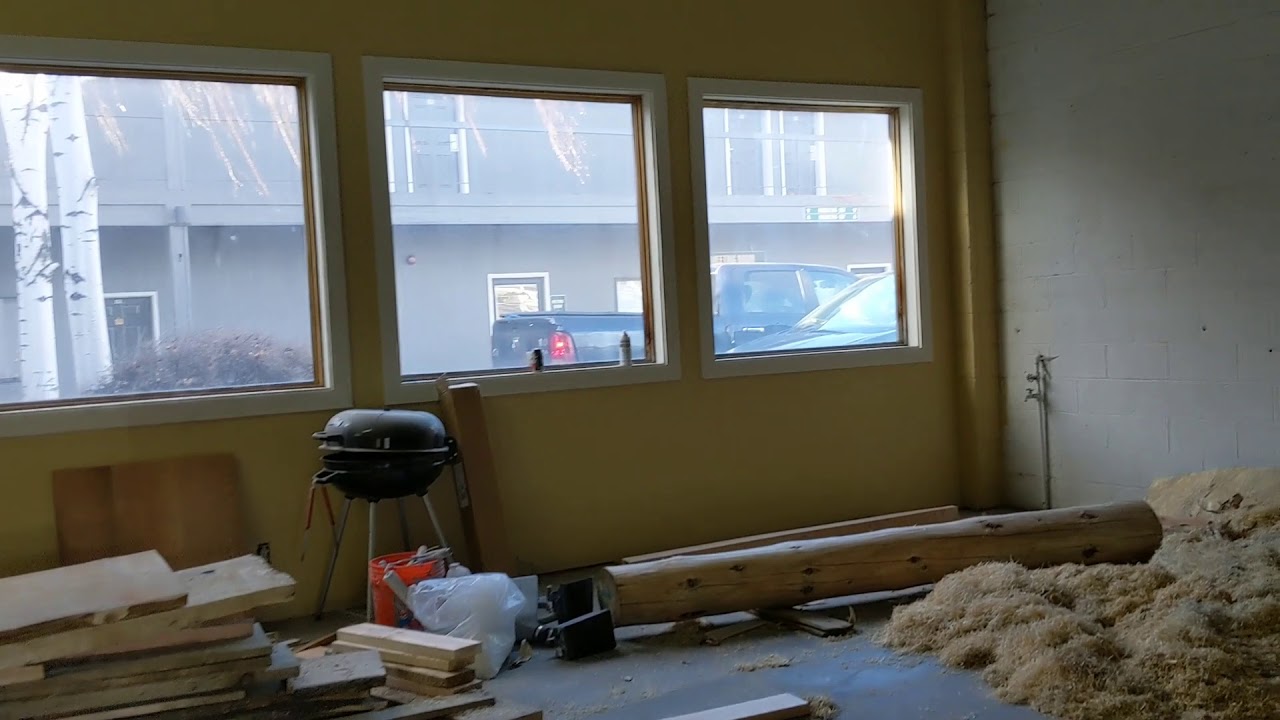 Resin chandelier in process! Custom carved and charred log sculpture