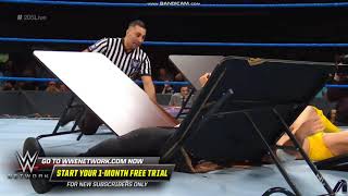 Oney Lorcan suplexes Ariya Daivari through 2 tables