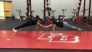 Partner Straight Arm Plank Claps