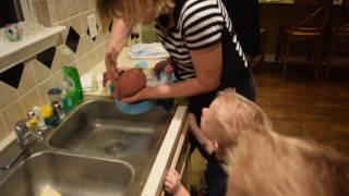 Robbie's 1st bath in the sink with G-ma