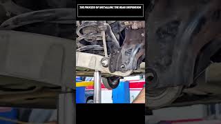 The process of installing the rear suspension assembly for Nissan car