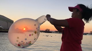 Blowing Giant Balloon While Watching The Beautiful Sunset Blowing In A Public Place