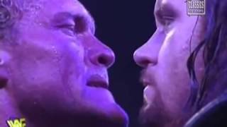 Sycho Sid and Undertaker face to face stare before Wrestlemania