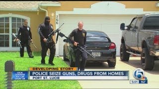 Police seize guns, drugs from homes