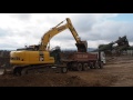 Komatsu pc29010 loading a dump truck with gravel