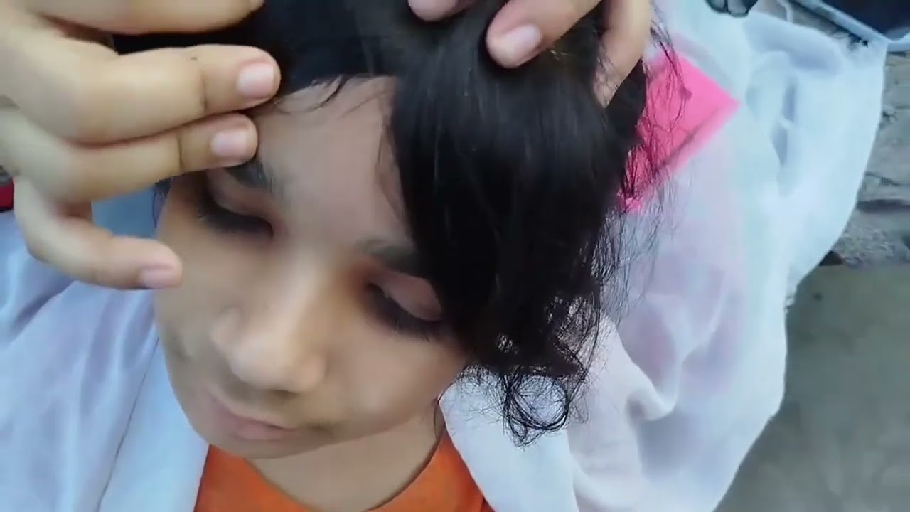 Hair checking of meerab by mom.