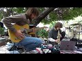 Listen to music outside in the daylight under a tree