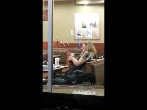 Lady cleans child's feet at Chick-Fil-A