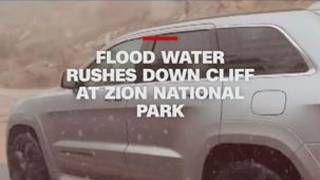 Flood waters rush down cliff at Zion National Park