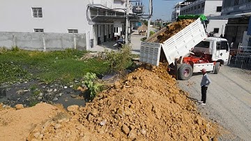 The Landfill Up Action Operator Bulldozer was developed recently Using dump truck push soil in water