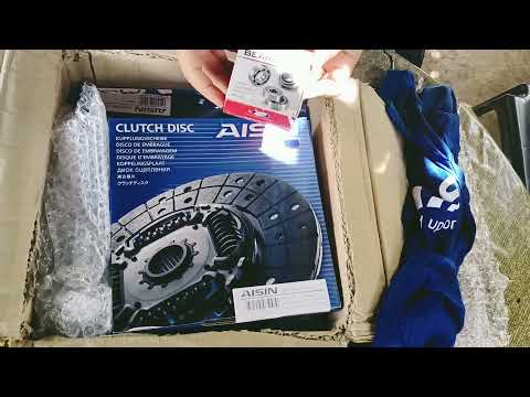 Unboxing Mitsubishi L300 clutch components for DIY repair.