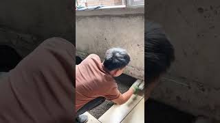 Leveling Concrete Floor Surface Evenly Using Wooden Screed