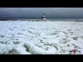 Quick flight over pancake ice  michigan city lighthouse 4k drone footage
