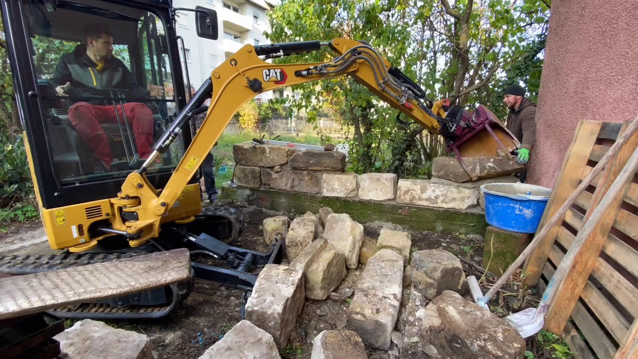 Sandsteinmauer mit Bagger mauern!!! CAT Minibagger mit Rototop und Multigrip