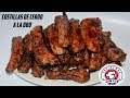 Deliciosas costillas de cerdo asadas y en salsa barbacoa o bbq