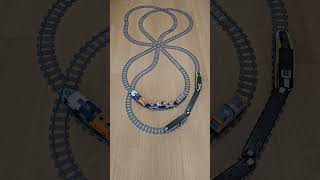 Two Lego Trains Collide On A Double-Figure-Eight Track