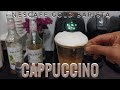 Making hazelnut cuppucino using nescafe gold blend barista machine