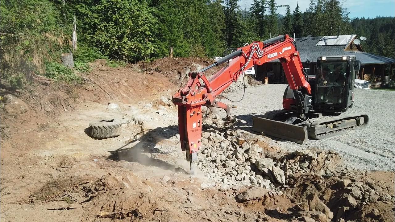 TMG Jackhammer with a Kubota 0804S smashing rock. YouTube