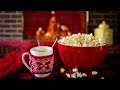 A steaming cup of coffee and the sound of a fireplace - perfect for reading a book. Cozy Video.