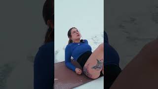 Evelina does stretching in the snow on the shore of the lake #stretching