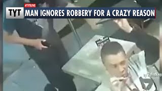 Man Completely Unfazed By Robber (VIDEO)