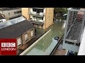 Residents in Hackney rescued from the flooding car park outside their homes- BBC London