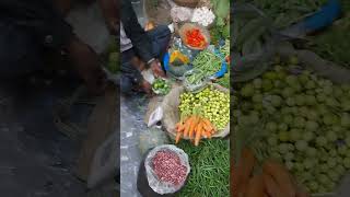 Man Selling Vegetables In The Open Market.