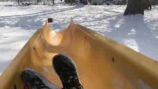 Sledding down a hill on a slide (Hillbilly sledding)