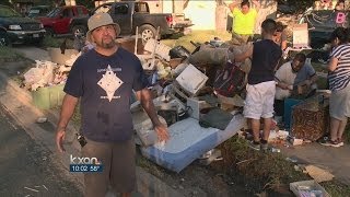 Families return home after the floods