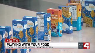Stacking food boxes to break a world record and help those in need