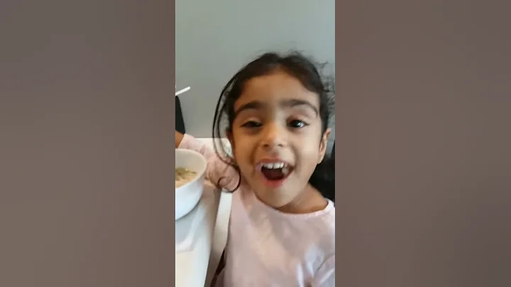 2 yr old eating with chopsticks