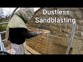 Dustless sandblasting old stone to match new extension