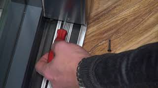 Adjusting the wheels on a WarmCore Inline Patio Door