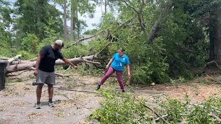 SEE HOW: Tornado destruction and debris traps neighbors on Burgess Drive