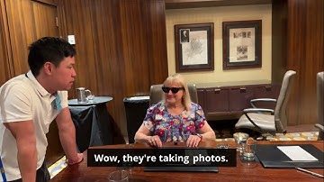 A lady trying EchoVision Live AI Demo using EchoVision during ACB